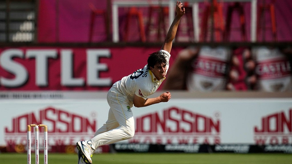 Australia's captain Pat Cummins follows through his delivery on day three of the first cricket test match between South Africa and Australia, in Durban, South Africa. - Themba Hadebe