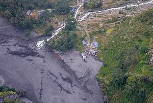 |Photo: PTI/Abhishek Maharjan : An aerial view shows mudslide debris and floodwaters overflowing the Budhi Gandaki river following a sudden flash flood triggered by a suspected landslide in the Chekampar area, in Gorkha district, Nepal, Sunday, Oct. 11, 2026. Preliminary reports indicate that around 35 houses and several bridges were swept away in the disaster. No casualties have been reported so far, according to the National Disaster Risk Reduction and Management Authority (NDRRMA).