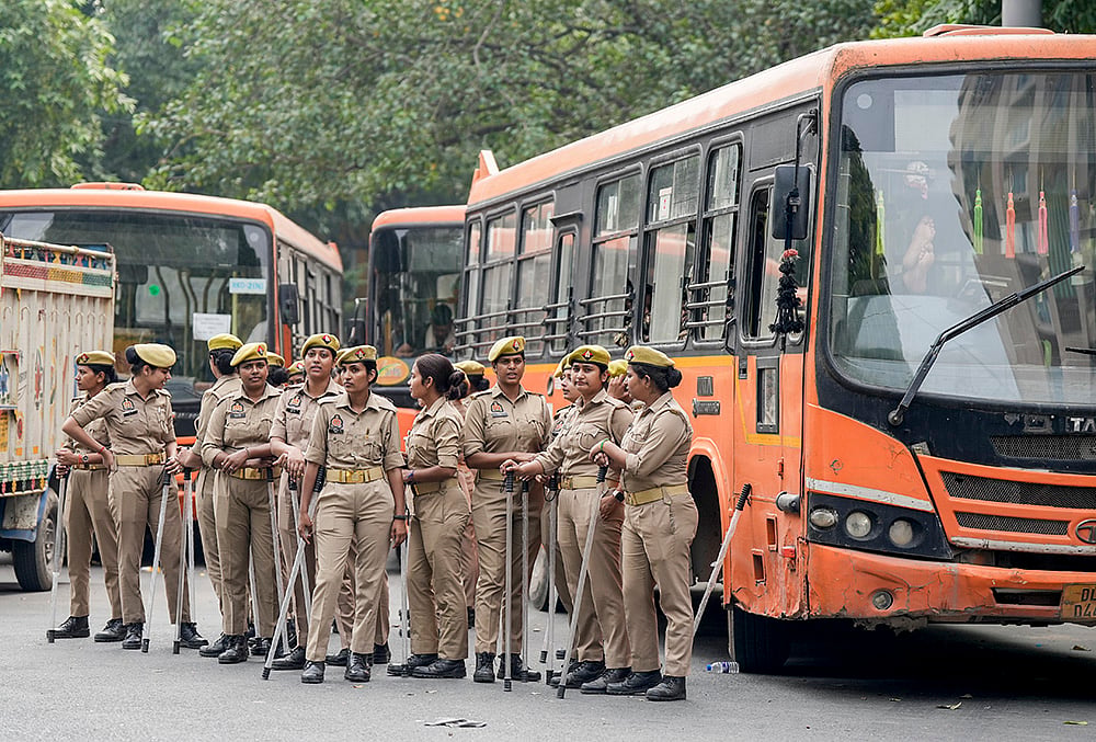 Uttar Pradesh (UP) Police personnel stand guard and maintain security near Gurudwara Bangla Sahib amid continued demonstration calls by the Cockroach Janta Party (CJP) demanding the resignation of Chief Election Commissioner (CEC) Gyanesh Kumar, in New Delhi, Sunday, Oct. 11, 2026. 