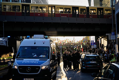 Police stand guard as pro-Palestinian protesters march during a rally in Berlin, Germany, Saturday, Oct. 10, 2026. 
