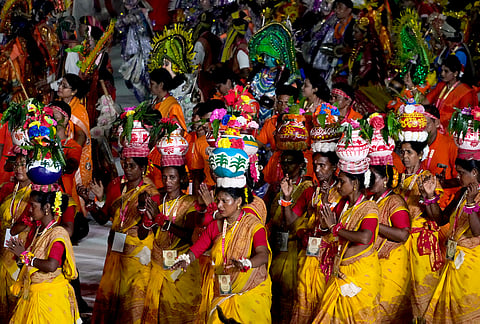 Folk dancers perform during a celebration ahead of Hindu festival Durga Puja, in Kolkata, India, Saturday, Oct. 10, 2026. 
