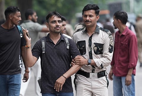 Security personnel keep vigil following continued demonstration calls by the Cockroach Janta Party (CJP) demanding the resignation of Chief Election Commissioner (CEC) Gyanesh Kumar, in New Delhi, Sunday, Oct. 11, 2026. 
