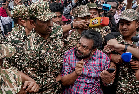 Police personnel detain CPI (M) MP John Brittas amid continued demonstration calls by the Cockroach Janta Party (CJP) demanding the resignation of Chief Election Commissioner (CEC) Gyanesh Kumar, in Connaught Place area, New Delhi, Sunday, Oct. 11, 2026. 
