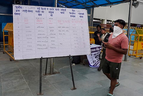 Passengers walk past a notice board outside the New Delhi Railway Station amid heightened security arrangements following planned protests by Cockroach Janta Party (CJP) members, in New Delhi, Saturday, Oct. 10, 2026. 
