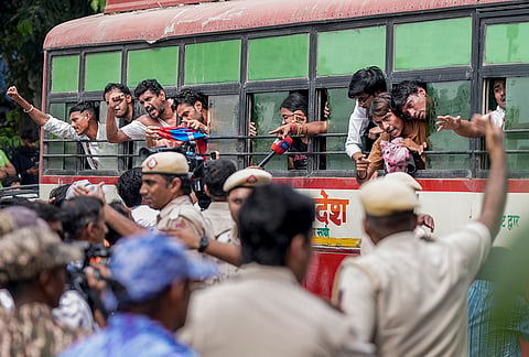 Police personnel detain activists of various student bodies amid continued demonstration calls by the Cockroach Janta Party (CJP) demanding the resignation of Chief Election Commissioner (CEC) Gyanesh Kumar, in Connaught Place area, New Delhi, Sunday, Oct. 11, 2026. 
