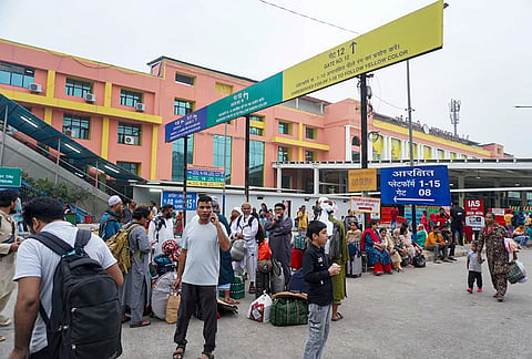Passengers wait outside the New Delhi Railway Station amid heightened security arrangements following planned protests by the Cockroach Janta Party (CJP), in New Delhi, Saturday, Oct. 10, 2026. 
