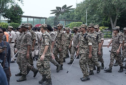 Security personnel keep vigil following continued demonstration calls by the Cockroach Janta Party (CJP) demanding the resignation of Chief Election Commissioner (CEC) Gyanesh Kumar, in New Delhi, Sunday, Oct. 11, 2026. 
