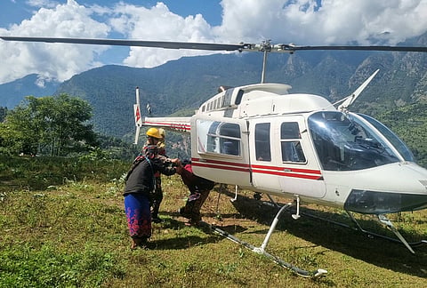 In this photo provided by the Nepal Army, residents affected by the flooding in Budhi Gandaki river in north central Nepal, are evacuated by a helicopter, Sunday, Oct. 11, 2026. 
