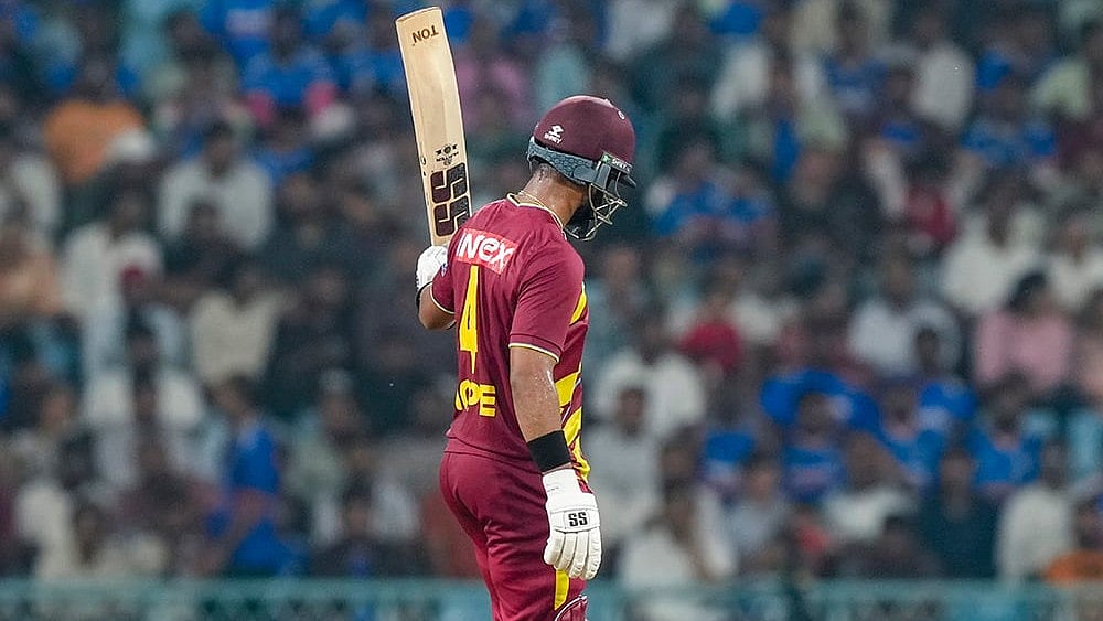 West Indies’ captain Shai Hope celebrates his half century during the first T20I cricket match of a series between India and West Indies, in Lucknow, Uttar Pradesh, Tuesday, Oct. 6, 2026.  - | Photo: PTI/Shahbaz Khan