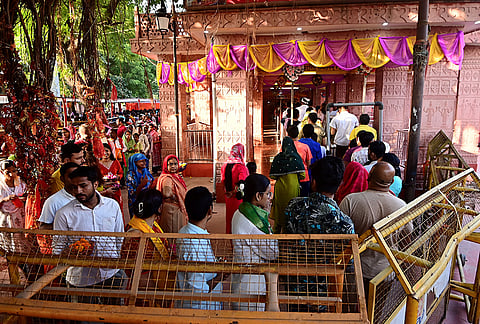 People arrive to offer prayers on the first day of the 'Sharad Navratri' festival, at Alopi Shankari Devi Shakti Peeth Mandir, in Prayagraj, Uttar Pradesh.