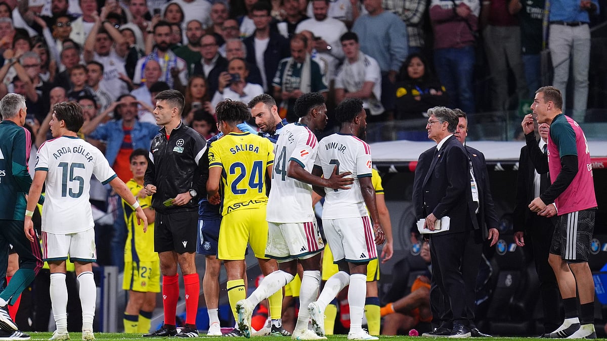 Real Madrid's Vinicius Junior leaves the pitch after being shown a red card during the La Liga soccer match between Real Madrid and Villarreal in Madrid, Spain, Saturday, Oct. 10, 2026. - (AP Photo/Manu Fernandez)