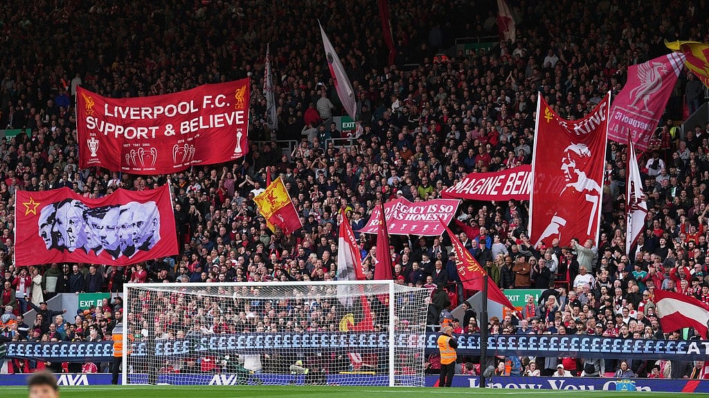 Liverpool fans display banners prior to the English Premier League soccer match between Liverpool and Manchester City in Liverpool, England, Sunday. - Jon Super/AP Photo