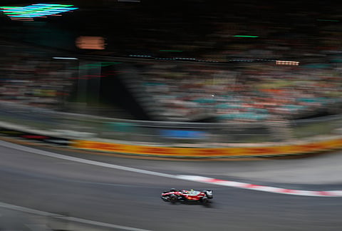 Ferrari driver Lewis Hamilton of Britain steers his car during the qualifying session ahead of the Singapore Formula One Grand Prix in Singapore, Saturday, Oct. 10, 2026. 
