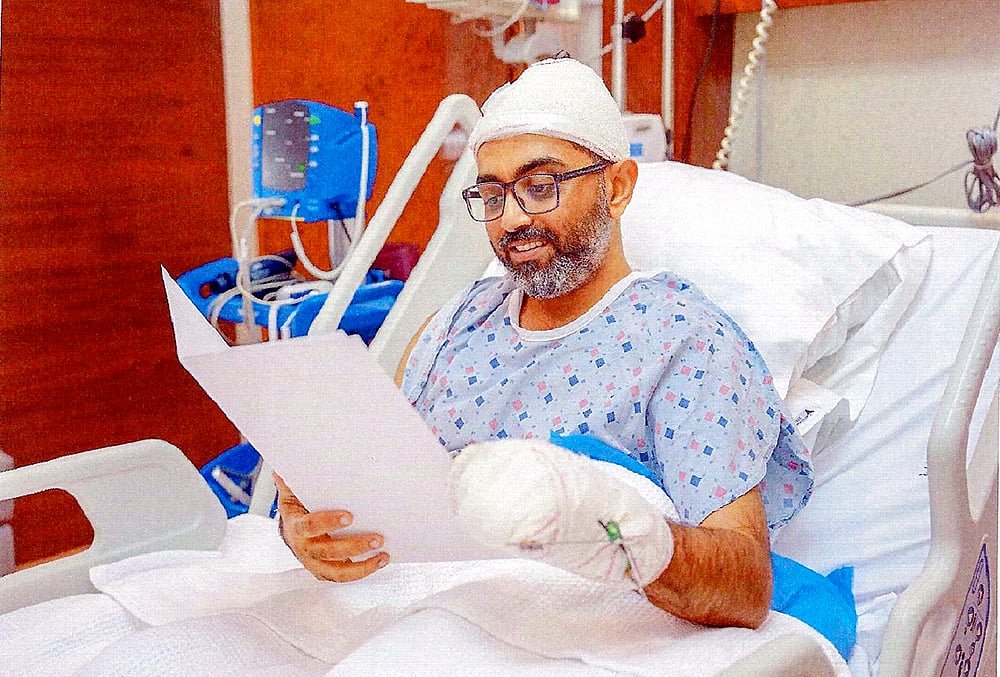 Flydubai pilot Captain Smit Machchhar reads an official letter from Israeli President Isaac Herzog, expressing gratitude for his courage during an emergency midair situation on Sept. 30, 2026.  - | Photo: Handout via PTI 