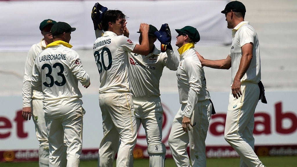 Australia's captain Pat Cummins, center, celebrates with his teammates after taking a wicket of South Africa's David Bedingham on day three of the first cricket test match between South Africa and Australia, in Durban, South Africa. - Themba Hadebe/AP Photo