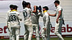 Themba Hadebe/AP Photo : Australia's captain Pat Cummins, center, celebrates with his teammates after taking a wicket of South Africa's David Bedingham on day three of the first cricket test match between South Africa and Australia, in Durban, South Africa.