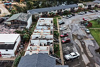 | Photo: AP/Gerald Herbert : An apartment complex which had its roof ripped off is seen in the aftermath of Hurricane Isaias in Milton, Fla., Saturday, Oct. 10, 2026. 