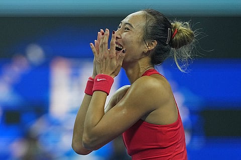 Zheng Qinwen, of China, celebrates after winning the women's singles final match against a Mirra Andreeva, of Russia at the China Open tennis tournament in Beijing, Sunday, Oct. 11, 2026.