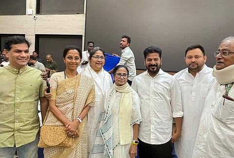 TMC supremo Mamata Banerjee in a photograph with party leaders Dola Sen, Saugata Roy, Telangana Chief Minister and Congress leader Revanth Reddy, NCP (SP) leader Supriya Sule, RJD leader Tejashwi Yadav and others during a protest march by INDIA bloc leaders towards Supreme Court, to file a petition against Chief Election Commissioner Gyanesh Kumar and 'vote chori', at Constitution Club of India, in New Delhi. 