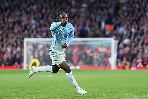 Manchester City's Jeremy Doku celebrates after scoring his side's second goal during the English Premier League soccer match between Liverpool and Manchester City in Liverpool, England, Sunday, Oct. 11, 2026.