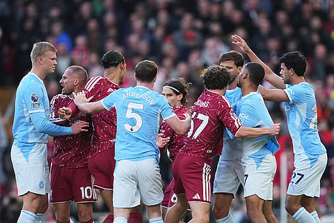 Players scuffle during the English Premier League soccer match between Liverpool and Manchester City in Liverpool, England, Sunday, Oct. 11, 2026.