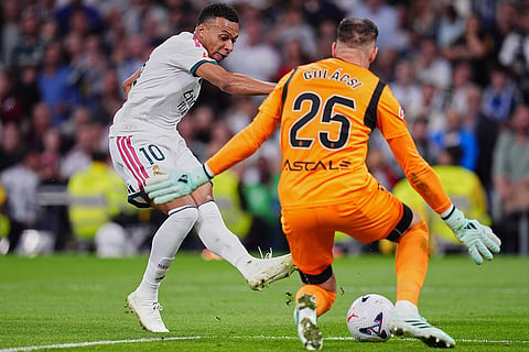 Villarreal's goalkeeper Peter Gulacsi saves shot by Real Madrid's Kylian Mbappe during the La Liga soccer match between Real Madrid and Villarreal in Madrid, Spain.