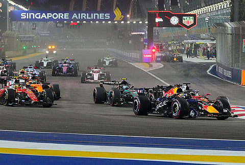 Red Bull driver Max Verstappen of the Netherlands leads the field after the start of the Singapore Formula One Grand Prix race in Singapore, Sunday, Oct. 11, 2026. 