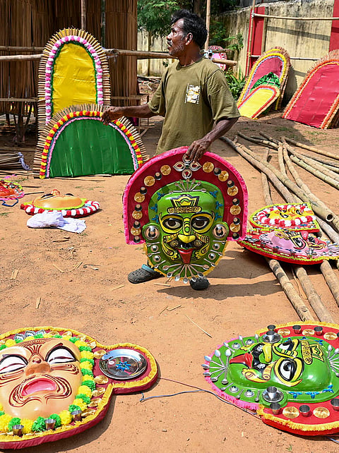 A worker carries decorative items for the ‘Durga Puja’ pandal, themed as “Tribals of the African Union” ahead of the festival, in Ranchi, Monday, Oct. 12, 2026. 
