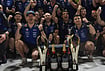 | Photo: AP/Ng Han Guan : Red Bull driver Max Verstappen of the Netherlands, center left celebrates with his team and teammate Isack Hadjar of France, center right after winning the Singapore Formula One Grand Prix race in Singapore, Sunday, Oct. 11, 2026. 