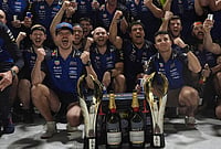 Max Verstappen Claims Maiden Singapore Grand Prix Victory | Photo: AP/Ng Han Guan : Red Bull driver Max Verstappen of the Netherlands, center left celebrates with his team and teammate Isack Hadjar of France, center right after winning the Singapore Formula One Grand Prix race in Singapore, Sunday, Oct. 11, 2026.
