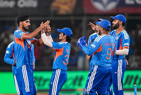 India's Arshdeep Singh, left, celebrates with teammates after taking the wicket of West Indies' captain Shai Hope during the third T20I cricket match of a series between India and West Indies, in Indore, Madhya Pradesh, Sunday, Oct. 11, 2026.