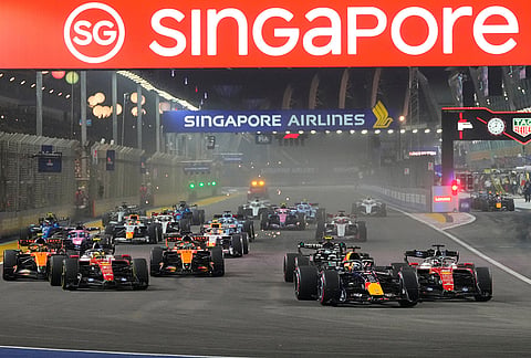 Red Bull driver Max Verstappen of the Netherlands leads the field after the start of the Singapore Formula One Grand Prix race in Singapore, Sunday, Oct. 11, 2026. 