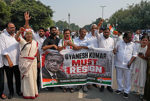 Workers of India's opposition Congress party shout slogans as they gather for a march toward the Supreme Court demanding the resignation of Chief Election Commissioner Gyanesh Kumar in New Delhi, India, Monday, Oct. 12, 2026. 
