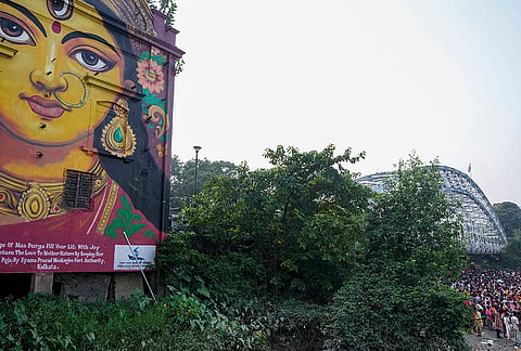 A mural artwork depicting Goddess Durga adorns a wall at a ferry ghat on the banks of Hooghly river, ahead of the Durga Puja festival, in Kolkata, West Bengal, Saturday, Oct. 10, 2026. 