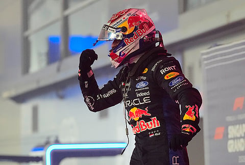 Red Bull driver Max Verstappen of the Netherlands celebrates after winning the Singapore Formula One Grand Prix race in Singapore, Sunday, Oct. 11, 2026. 