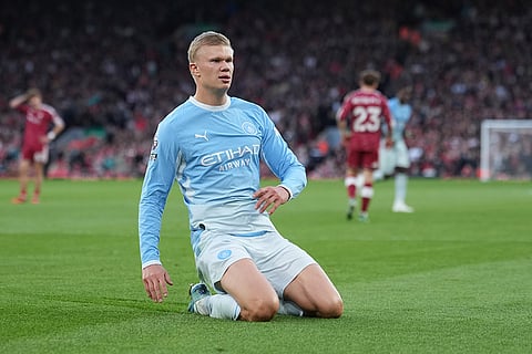 Manchester City's Erling Haaland celebrates after scoring his side's opening goal during the English Premier League soccer match between Liverpool and Manchester City in Liverpool, England, Sunday, Oct. 11, 2026.
