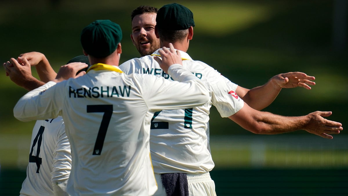Australia's Josh Hazlewood, back, celebrates with his teammates after taking a wicket on day four of the first cricket test match between South Africa and Australia, in Durban, South Africa, Monday, Oct. 12, 2026 - (AP Photo/Themba Hadebe)