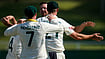 (AP Photo/Themba Hadebe) : Australia's Josh Hazlewood, back, celebrates with his teammates after taking a wicket on day four of the first cricket test match between South Africa and Australia, in Durban, South Africa, Monday, Oct. 12, 2026