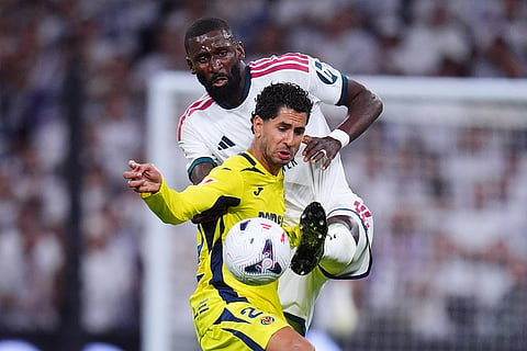 Villarreal's Ayoze Perez, front , and Real Madrid's Antonio Rudiger fight for the ball during the La Liga soccer match between Real Madrid and Villarreal in Madrid, Spain.