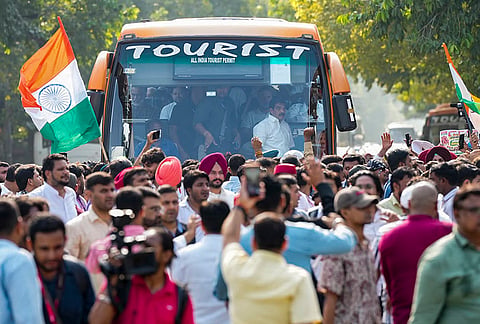 Congress President Mallikarjun Kharge, party leader Rahul Gandhi and other members of the INDIA bloc move in a bus towards during their "March for Democracy" to the Supreme Court against Chief Election Commissioner (CEC) Gyanesh Kumar, in New Delhi, Monday, Oct. 12, 2026. 
