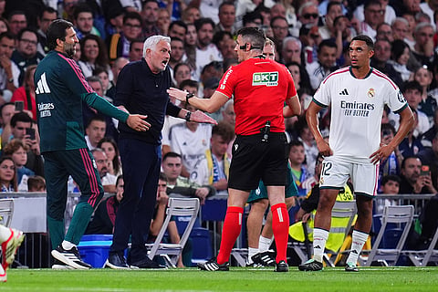 Real Madrid's head coach Jose Mourinho argues with a referee during the La Liga soccer match between Real Madrid and Villarreal in Madrid, Spain.