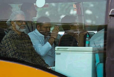 Congress leader Priyanka Gandhi Vadra, RJD leader Tejashwi Yadav and  other members of the INDIA bloc move in a bus during their "March for Democracy" to the Supreme Court against Chief Election Commissioner (CEC) Gyanesh Kumar, in New Delhi, Monday, Oct. 12, 2026. 
