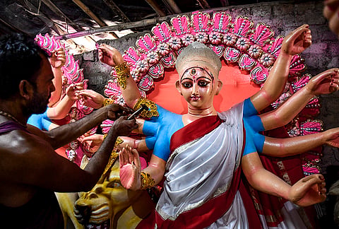 An artist paints an idol of Goddess Durga at a workshop ahead of Durga Puja festival, in Prayagraj, Uttar Pradesh, Tuesday, Oct. 6, 2026. 
