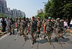 In Photos: Security Tightened Ahead Of Rahul Gandhi-led INDIA Bloc March To Supreme Court | Photo: AP/Manish Swarup : Security personnel escort workers of India's opposition Congress party as they gather for a march toward the Supreme Court demanding the resignation of Chief Election Commissioner Gyanesh Kumar in New Delhi, India, Monday, Oct. 12, 2026.