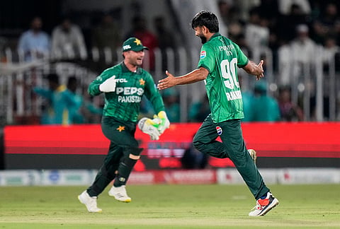 Pakistan's Mohammad Imran, right, celebrates the wicket of Sri Lanka's Sahan Arachchige during the second T20 cricket match between Pakistan and Sri Lanka, in Rawalpindi, Pakistan, Sunday, Oct. 11, 2026.