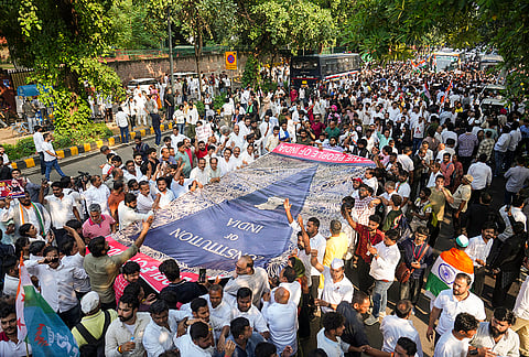 Supporters at Barakhamba road during ‘March for Democracy’ by INDIA bloc leaders to the Supreme Court, to file a petition against Chief Election Commissioner Gyanesh Kumar and 'vote chori', in New Delhi, Monday, Oct. 12, 2026. 
