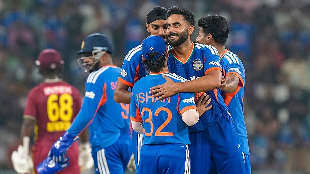 India's Naman Dhir celebrates with Ishan Kishan, Arshdeep Singh and Mayank Yadav after taking the wicket of West Indies' Shamar Springer during the first T20I cricket match of a series between India and West Indies, in Lucknow, Uttar Pradesh, Tuesday, Oct. 6, 2026.  - | Photo: PTI/Shahbaz Khan