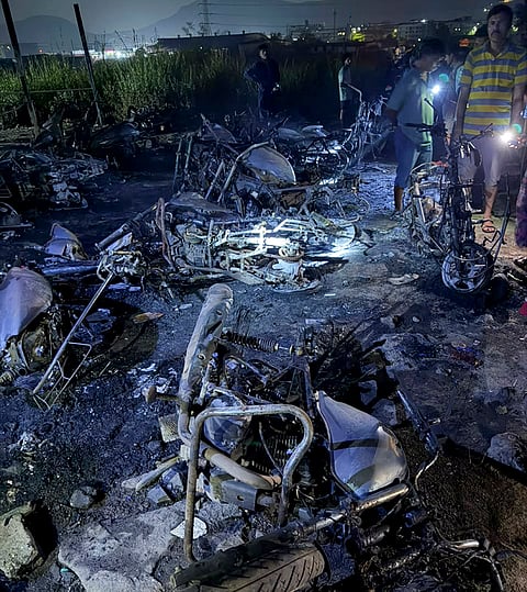 Charred remains of vehicles after an auto-rickshaw and 22 two-wheelers were gutted in a fire, near a school, in Maharashtra's Thane city.