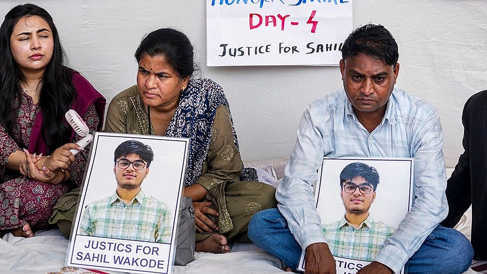 Parents of IIT Bombay student Sahil Wakode, who allegedly died by suicide, Ravindra Wakode, right, and Sonali Wakode, centre, stage a protest - | Photo: PTI/Shashank Parade