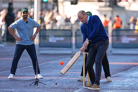 Britain's Prince William bats with a cricket rack as he joins cricketing stars from the United Kingdom and India at a special Earthshot Prize event called 'Cricket at the Mall' in London, Tuesday, Oct. 13, 2026, ahead of the Earthshot Prize's annual Summit and Awards Night in Mumbai in November.